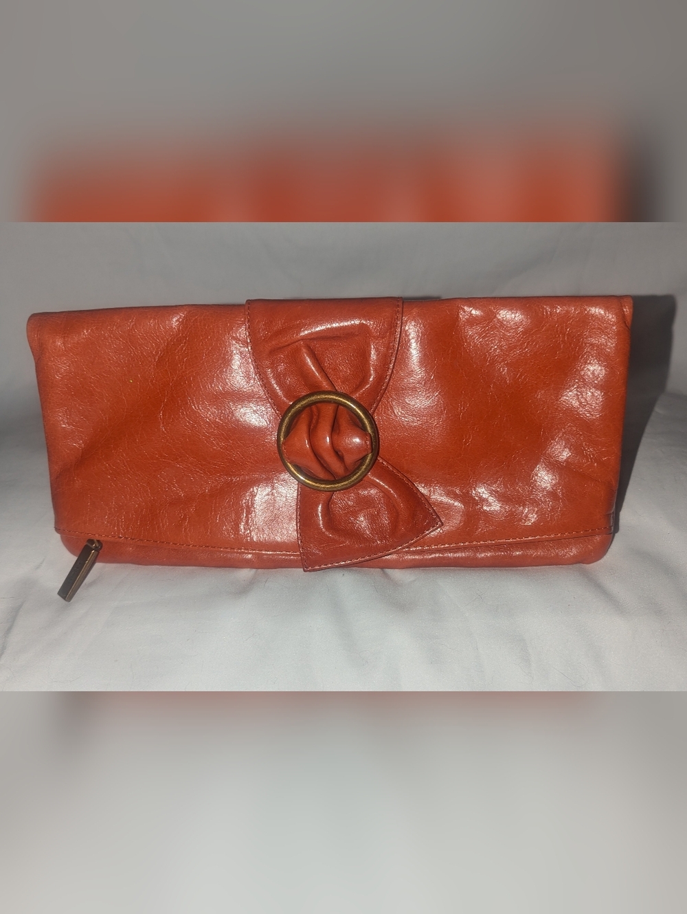 HOBO International Orange Leather Bow  Fold-Over Clutch with Brass Ring Detail